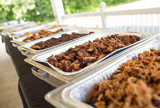 Trays of BBQ catering delivered by Famous Dave's